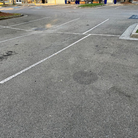 a parking lot with white lines