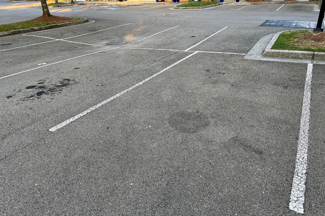 a parking lot with white lines