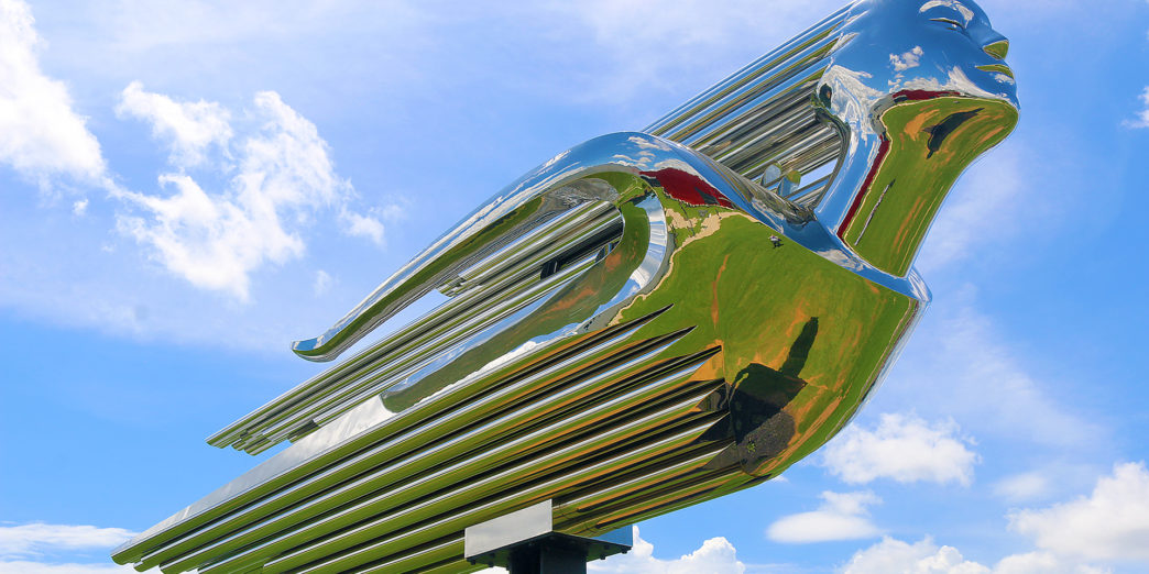 a metal sculpture of a bird