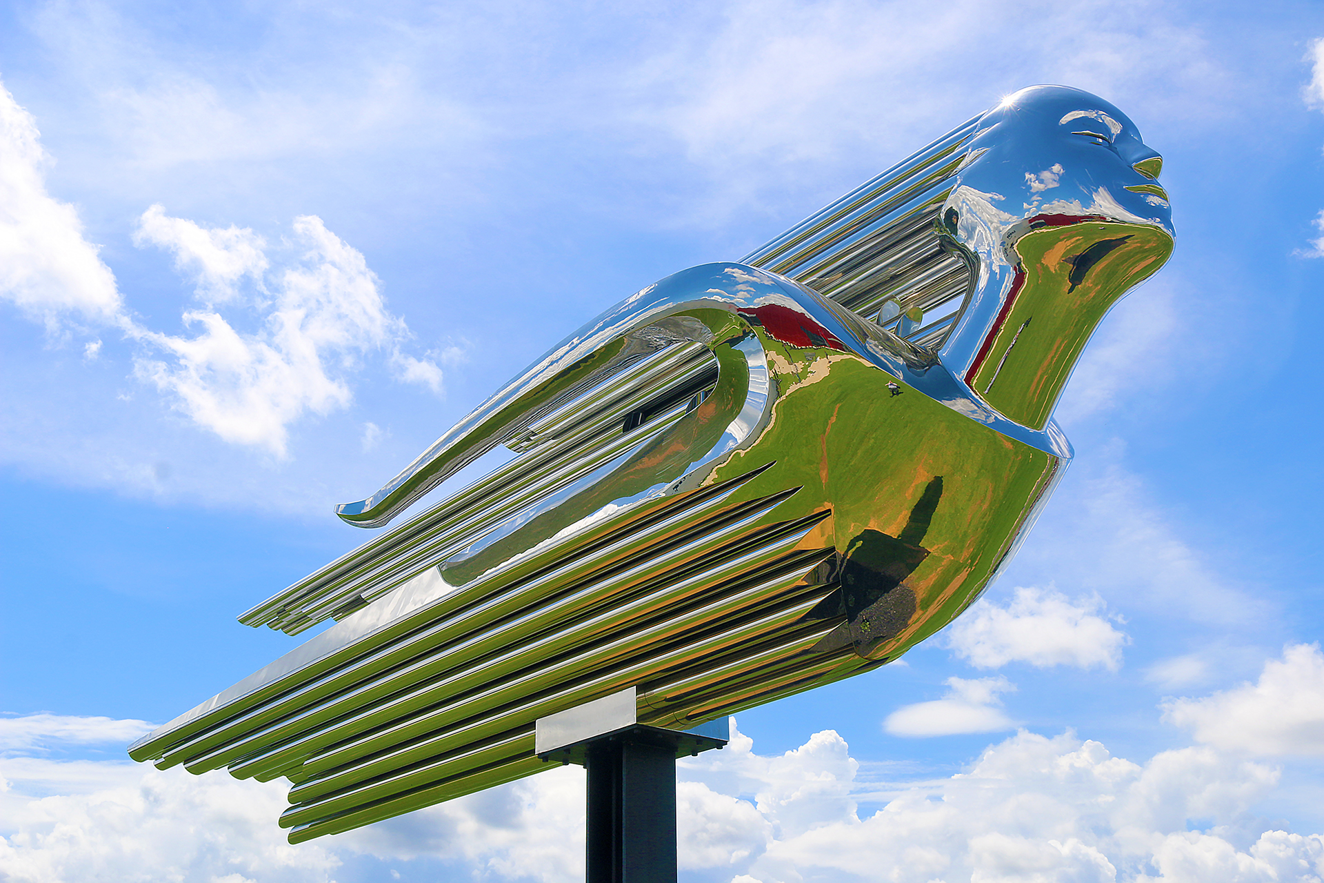 a metal sculpture of a bird