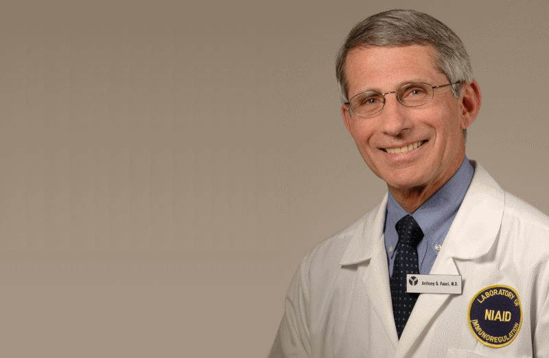 a man in a white coat