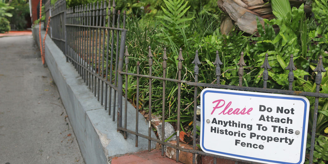 a fence with a sign on it