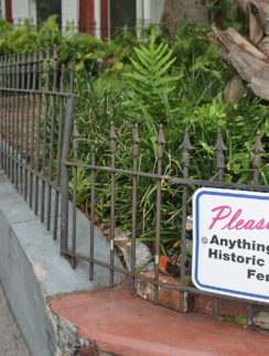 a fence with a sign on it