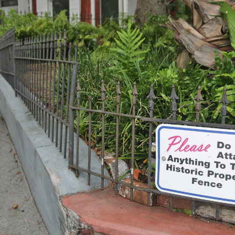 a fence with a sign on it