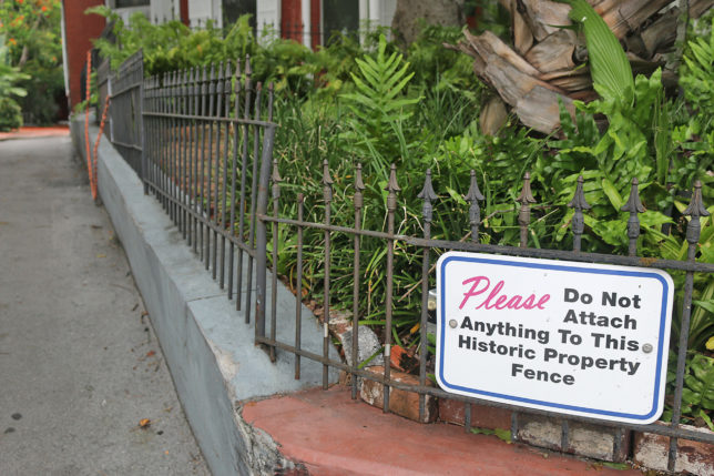 a fence with a sign on it