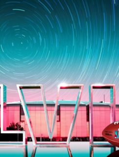 a football and a ball in front of a building