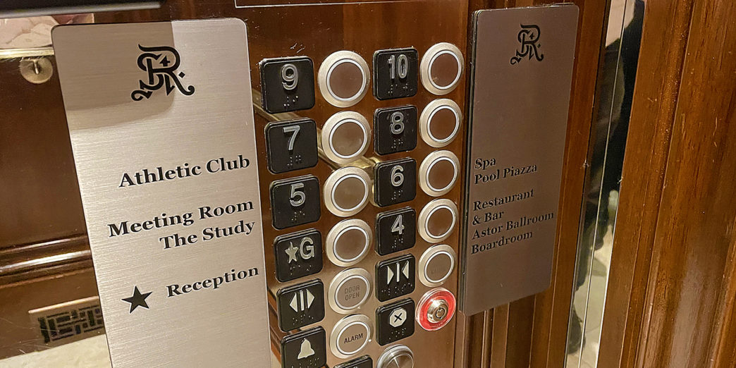 a elevator buttons and signs