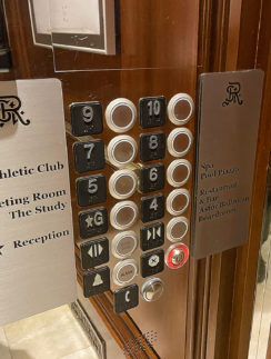 a elevator buttons and signs