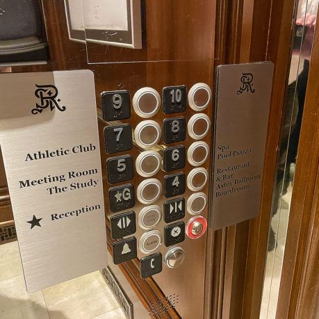a elevator buttons and signs