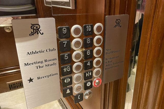 a elevator buttons and signs