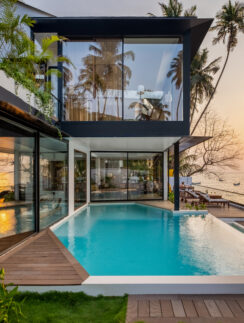 a house with a pool and a dock