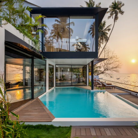 a house with a pool and a dock
