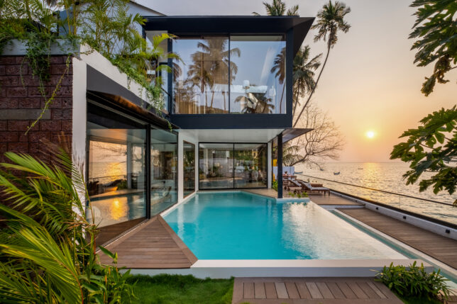 a house with a pool and a dock
