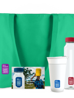 a green bag with a white bottle and a red lid