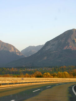 a road with a mountain range in the background