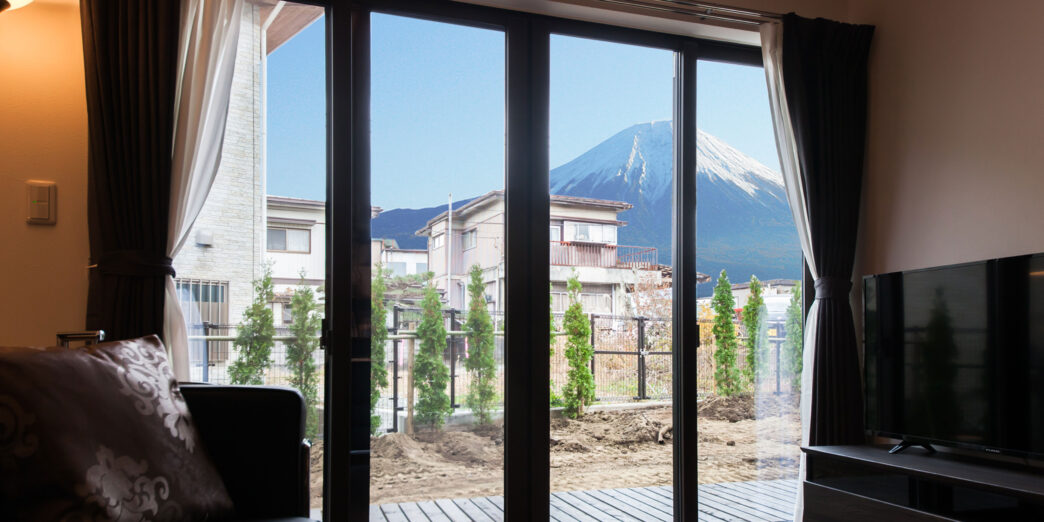 a room with a view of a mountain and a couch
