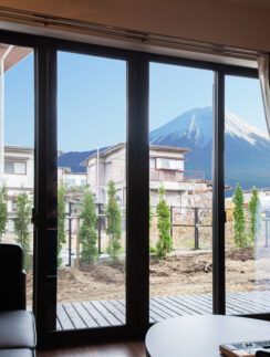 a room with a view of a mountain and a couch