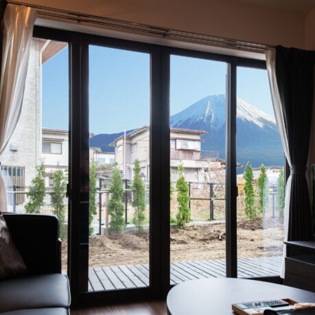 a room with a view of a mountain and a couch