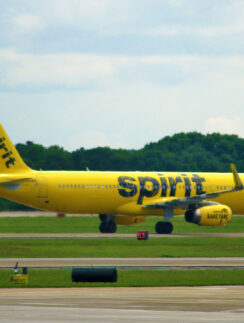 a yellow airplane on a runway