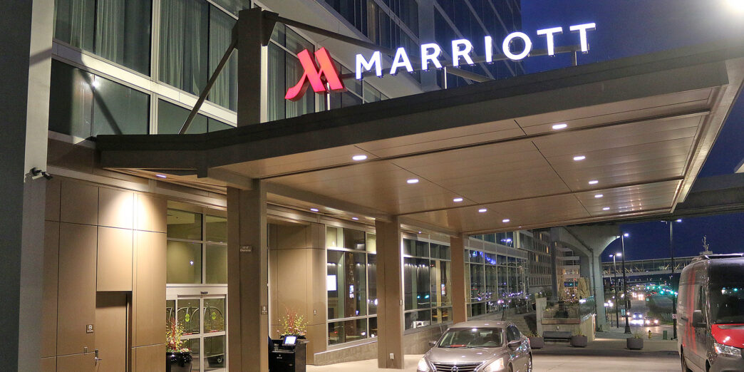 a car parked at a hotel entrance