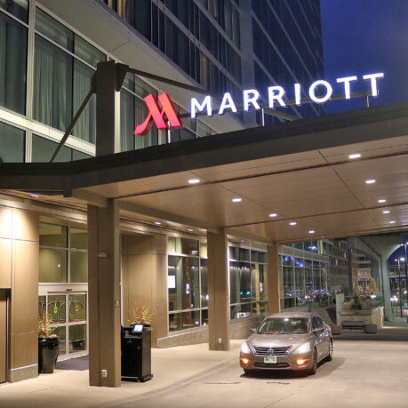 a car parked at a hotel entrance