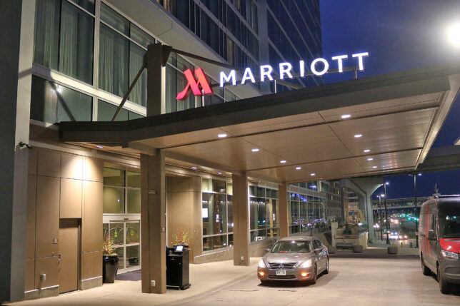 a car parked at a hotel entrance