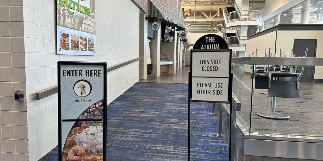 signs in a hallway of a building