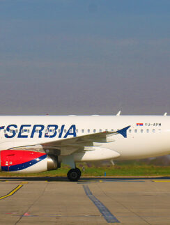 a white airplane on a runway