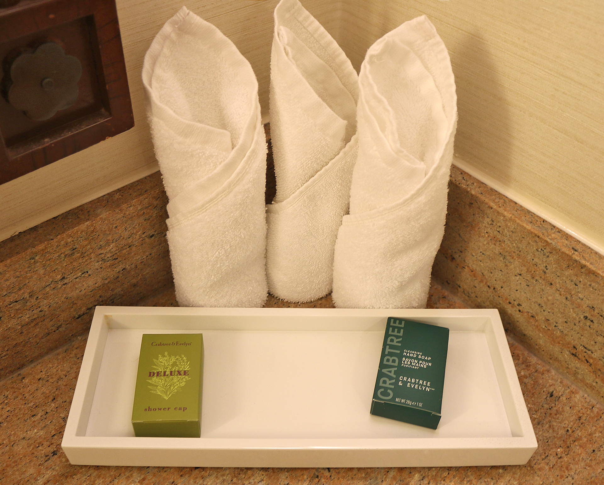 a tray with towels and a box on it