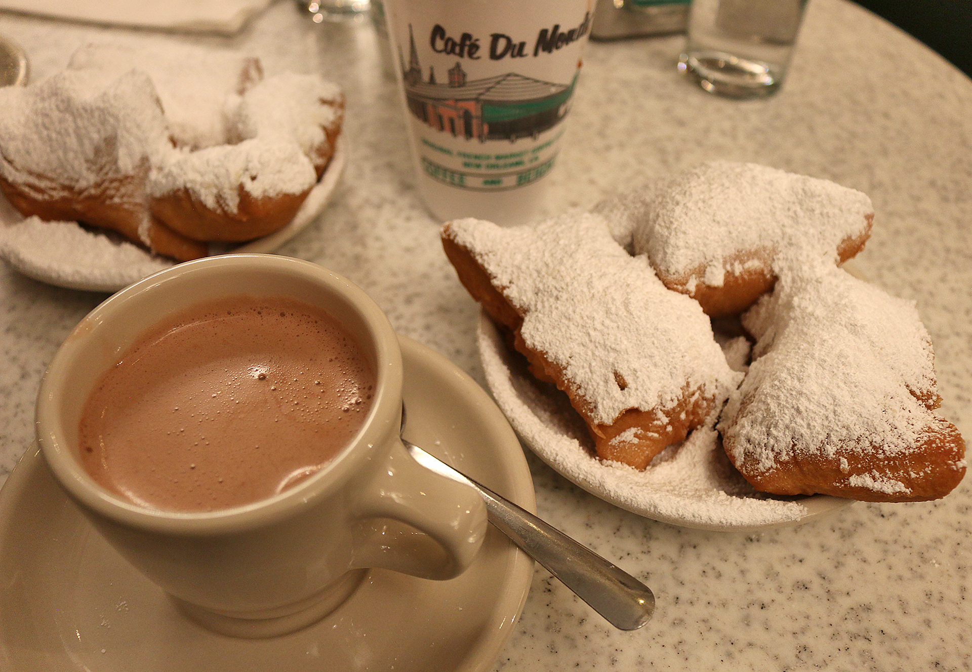 a plate of pastries and a cup of hot chocolate