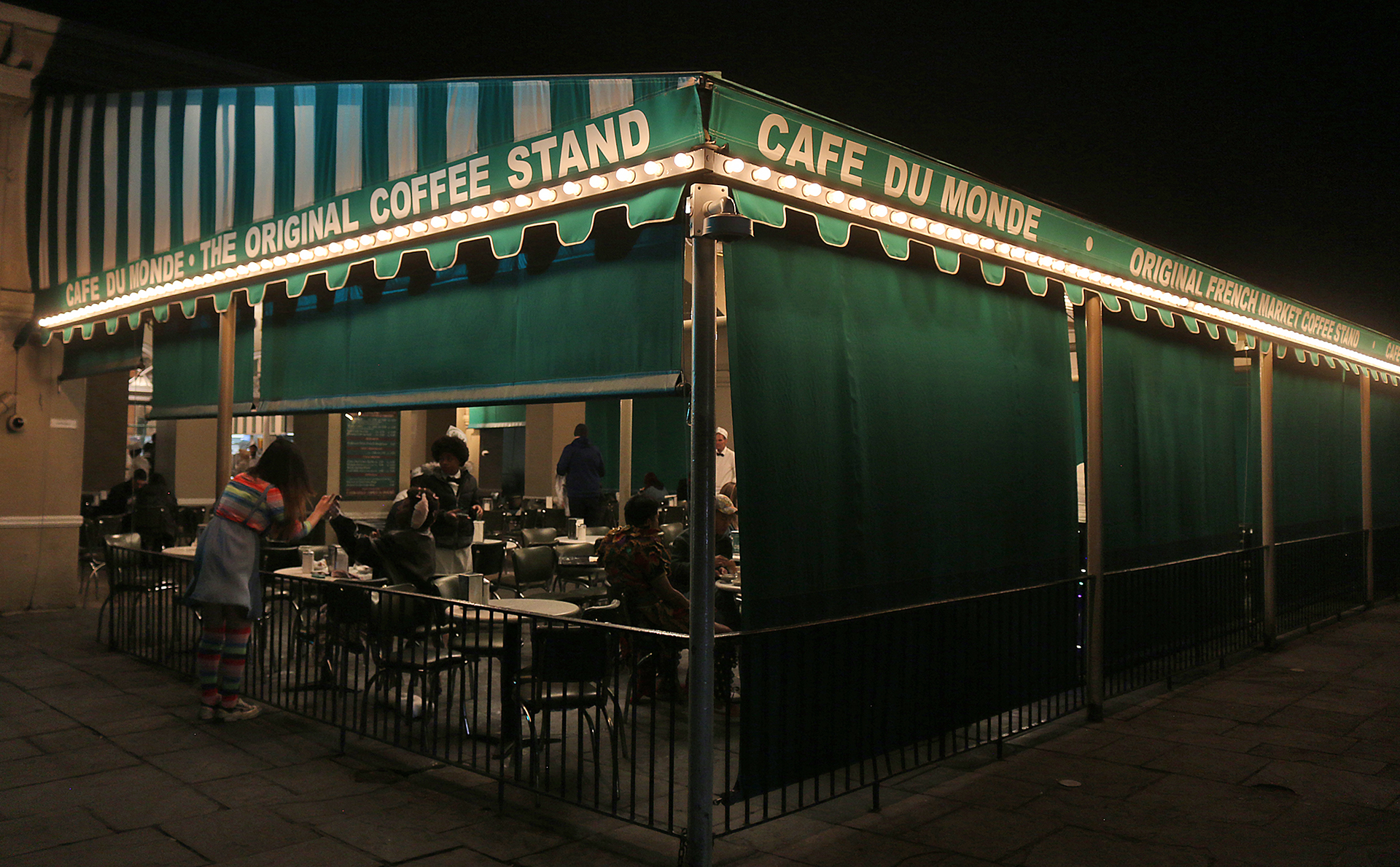 a green awning with white text on it