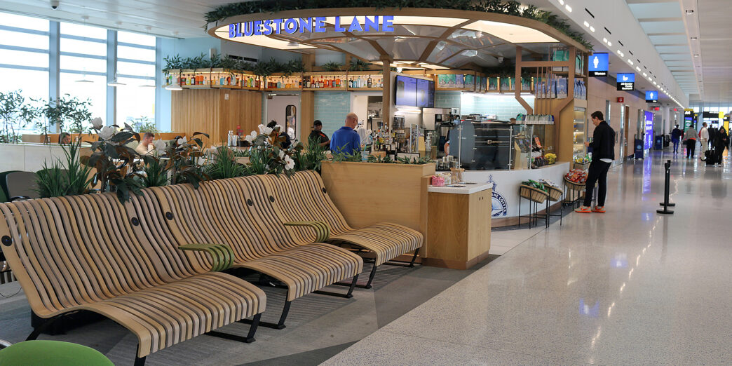 a lounge area with chairs and a bar