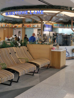 a lounge area with chairs and a bar