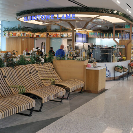 a lounge area with chairs and a bar