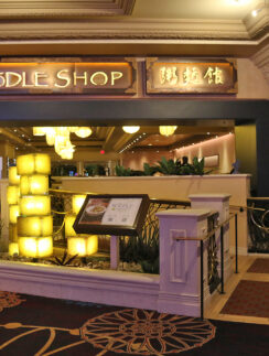 a building with a sign and a railing