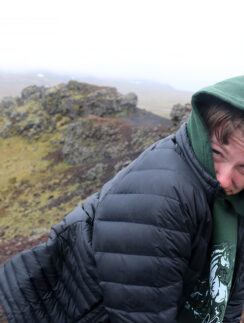 a man in a black coat