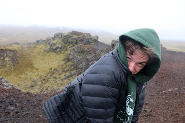 a man in a black coat