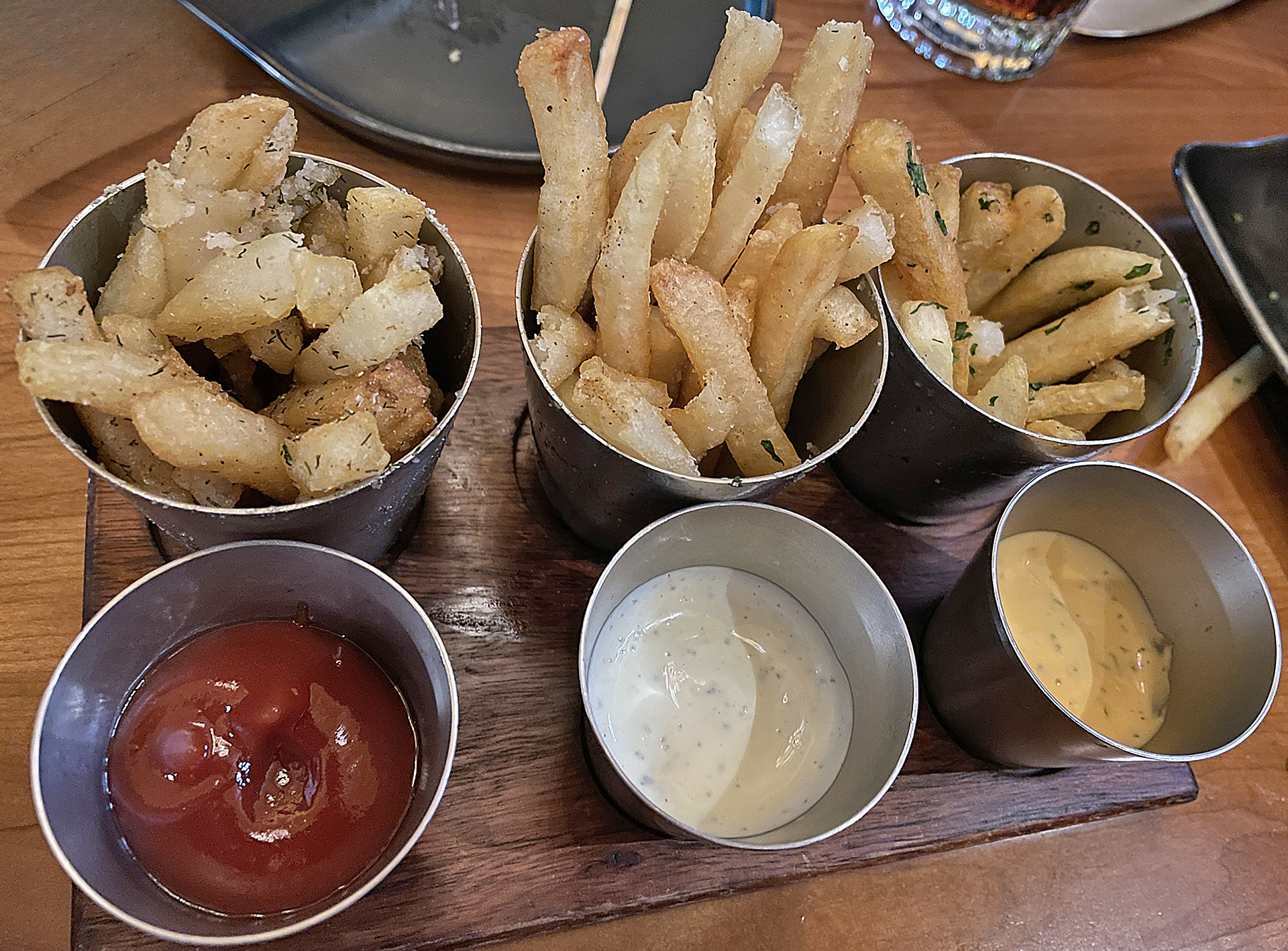 a tray of french fries and sauces