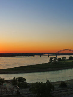 a sunset over a river