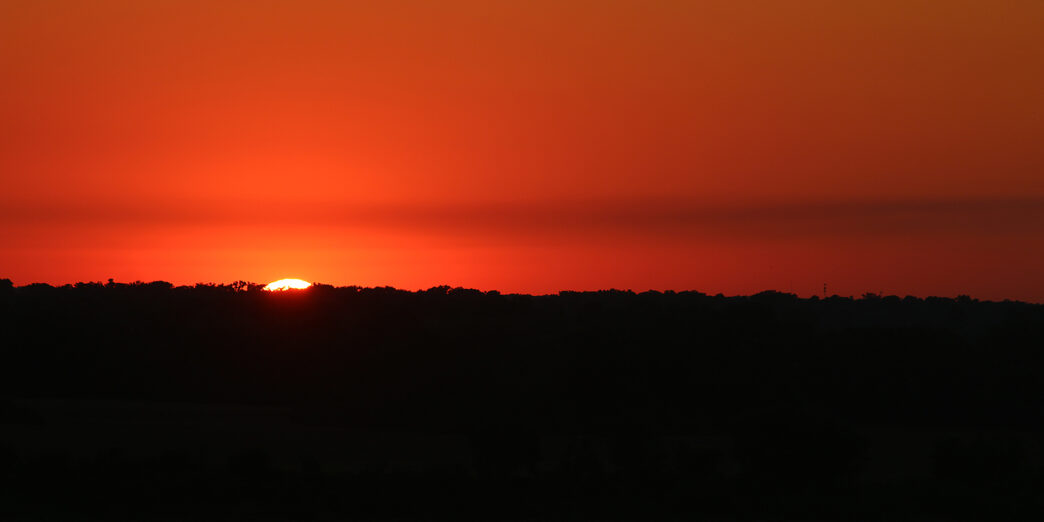 a sunset over a body of water