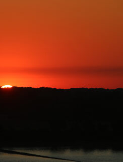 a sunset over a body of water