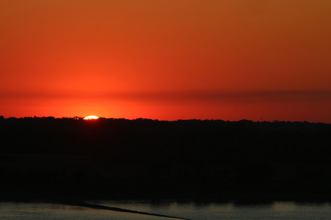 a sunset over a body of water