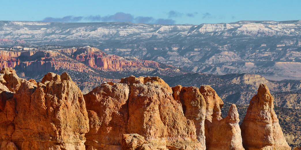 a rocky mountains with blue sky