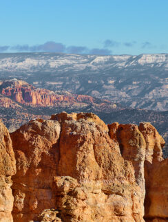 a rocky mountains with blue sky