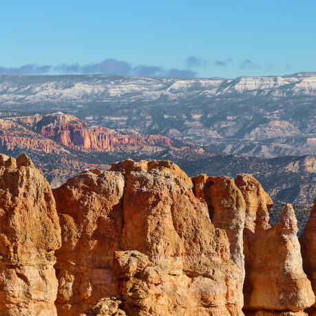 a rocky mountains with blue sky