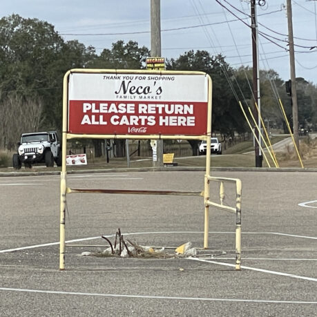 a sign in a parking lot