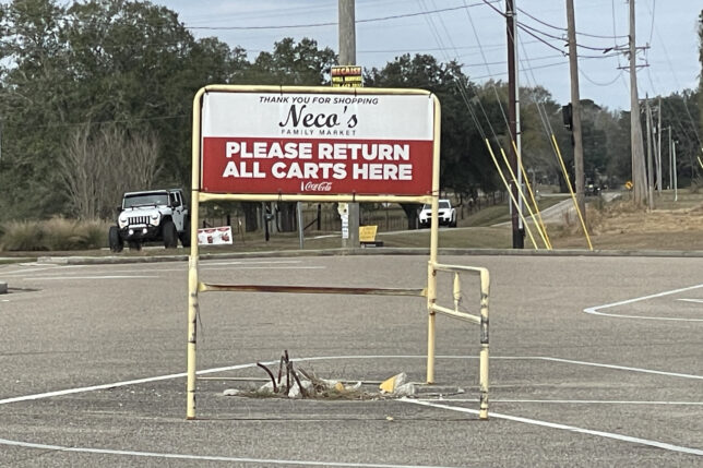 a sign in a parking lot