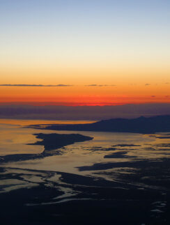 a sunset over a body of water