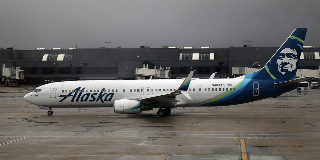 a white airplane on a runway