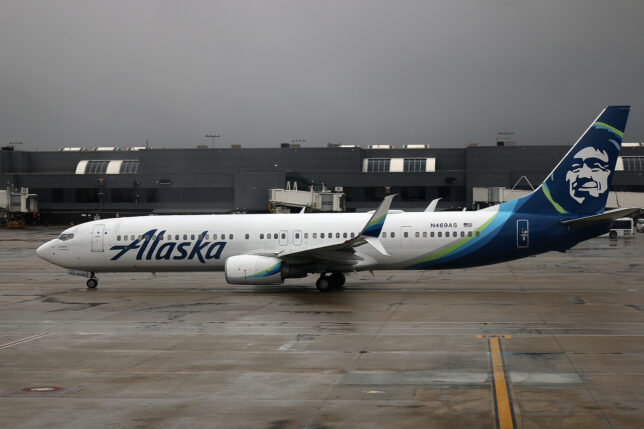 a white airplane on a runway